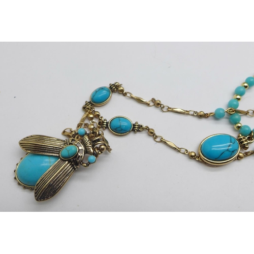 1135 - A pair of turquoise coloured beetle earrings and necklace set, and one other turquoise coloured bead... 