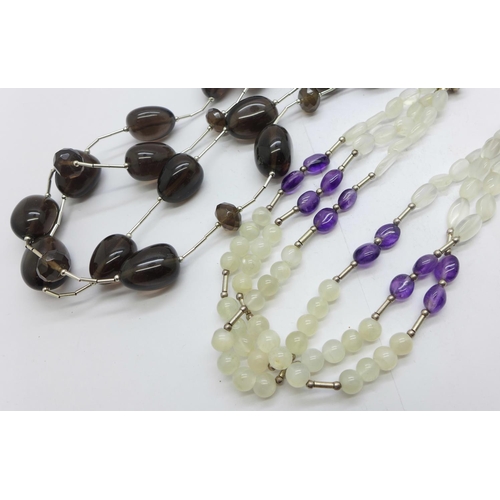 1137 - A silver mounted smoky quartz necklace, and a silver mounted amethyst and quartz necklace