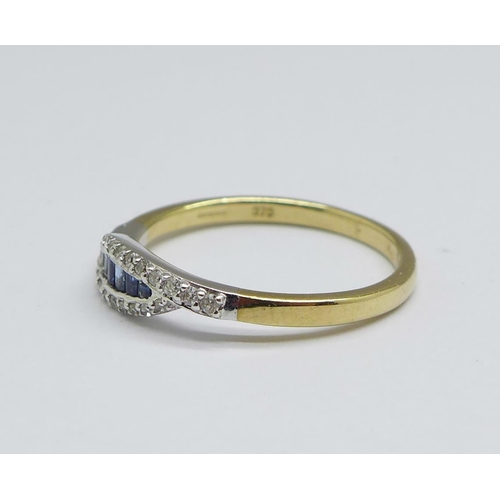 1142 - A 9ct gold, sapphires and twenty-four diamond crossover ring, 2.3g, Q