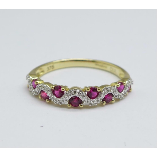 1150 - A 9ct gold, ruby and diamond half eternity ring, 1.5g, N