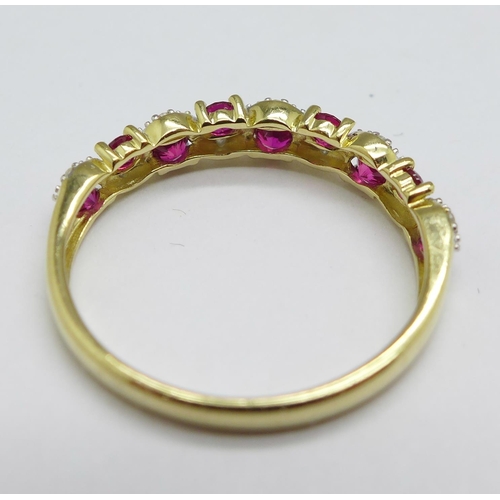 1150 - A 9ct gold, ruby and diamond half eternity ring, 1.5g, N