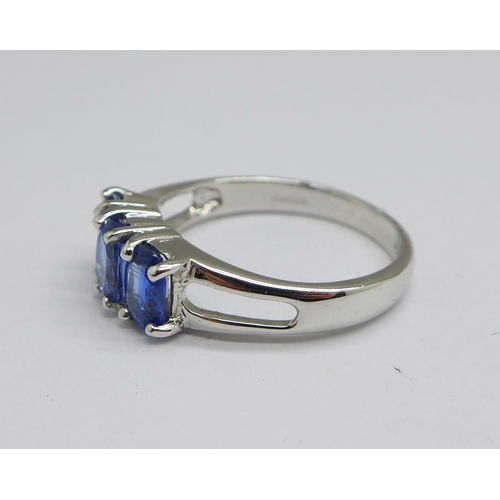 1154 - A 9ct white gold and three stone tanzanite ring, 3.2g, N