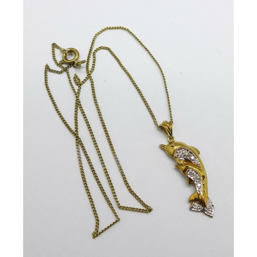 1159 - A 9ct gold and diamond studded dolphin pendant on a silver gilt chain, pendant 1.4g