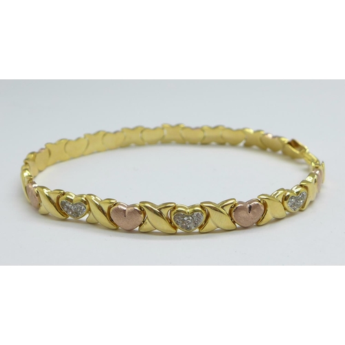 1165 - A hallmarked silver gilt heart bracelet