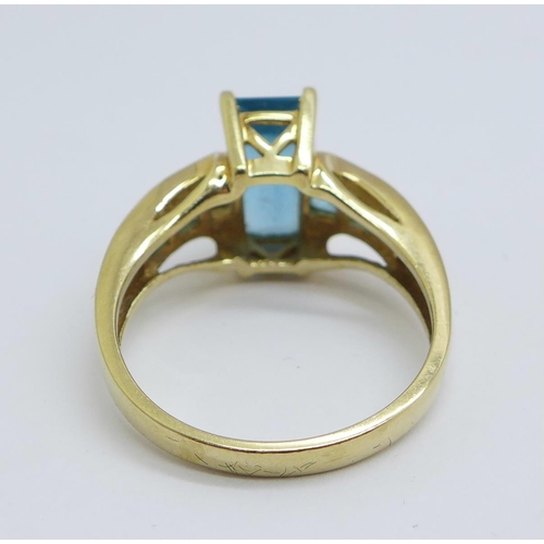 1168 - A 9ct gold and blue stone ring, 4.9g, Q, lacking one stone