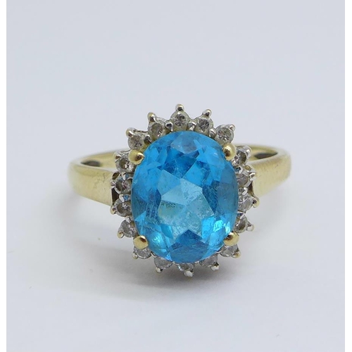 1169 - A 9ct gold, blue and white stone cluster ring, 3.2g, O