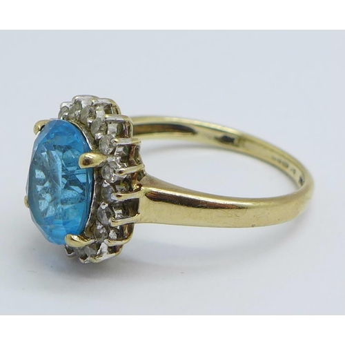 1169 - A 9ct gold, blue and white stone cluster ring, 3.2g, O