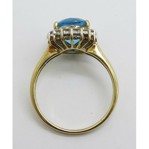 1169 - A 9ct gold, blue and white stone cluster ring, 3.2g, O