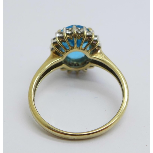 1169 - A 9ct gold, blue and white stone cluster ring, 3.2g, O