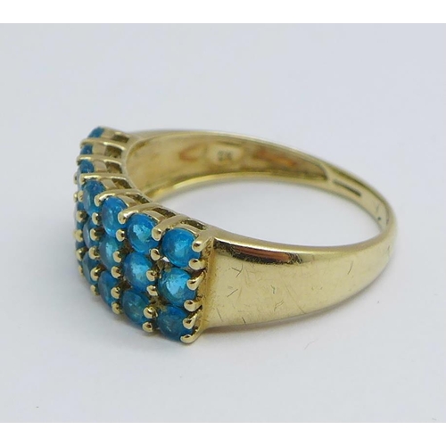 1170 - A 9ct gold ring set with twenty-one blue stones, 2.3g, O