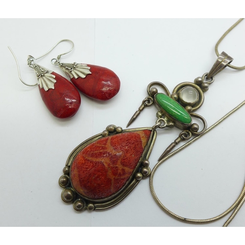 1173 - A silver gem set pendant and chain and a pair of silver mounted earrings