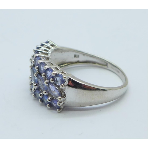 1188 - A 9ct white gold ring set with violet coloured stones, 4.1g, Q