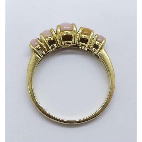 1191 - A 9ct gold, five stone ring, 2.9g, Q, (one stone possibly replaced)