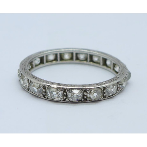 1192 - A white metal set diamond full eternity ring, 2.8g, M, set with seventeen diamonds, band width appro... 