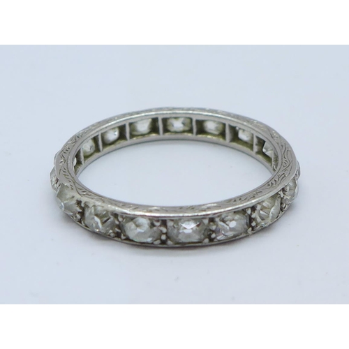 1192 - A white metal set diamond full eternity ring, 2.8g, M, set with seventeen diamonds, band width appro... 