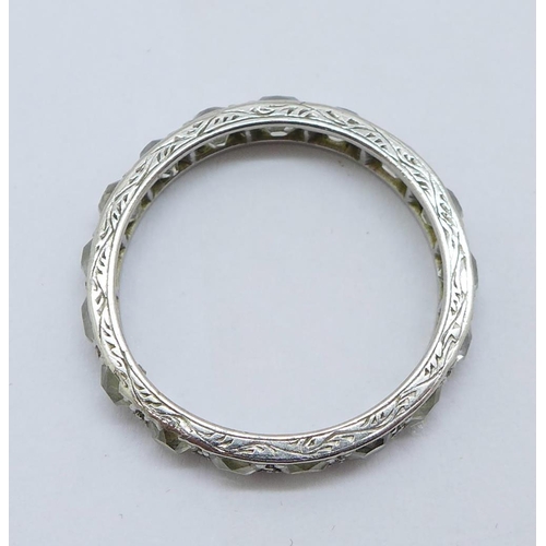 1192 - A white metal set diamond full eternity ring, 2.8g, M, set with seventeen diamonds, band width appro... 