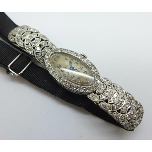 1197 - A lady's Art Deco diamond set cocktail wristwatch, the case marked 'Platine', 18/19mm wide, lacking ... 