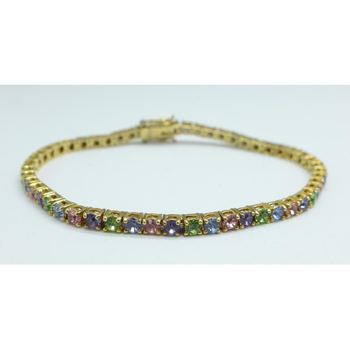 1200 - A silver gilt multi coloured gem set bracelet