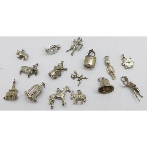 1202 - Fifteen silver charms, 46g