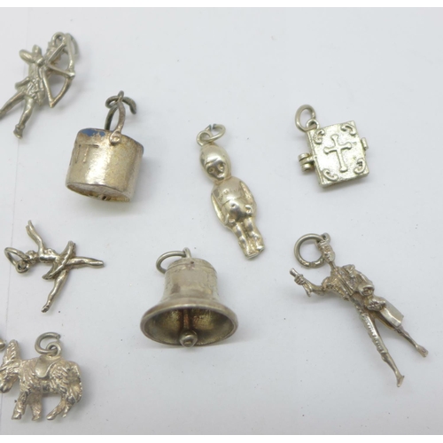 1202 - Fifteen silver charms, 46g