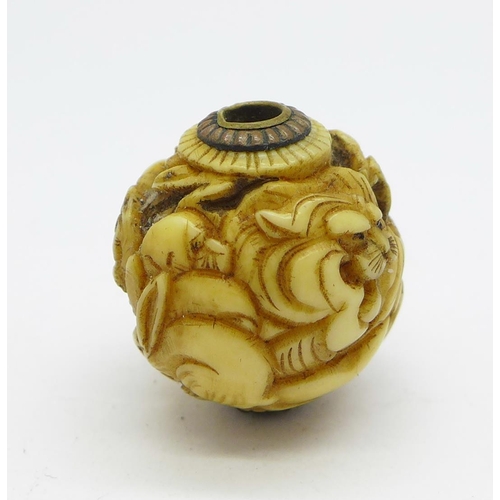 1215 - A Japanese Meiji period carved ivory ball/charm depicting animals, signed