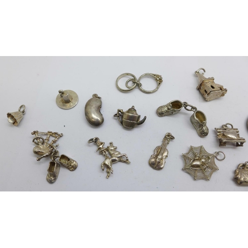 1216 - Twenty silver charms, 36g