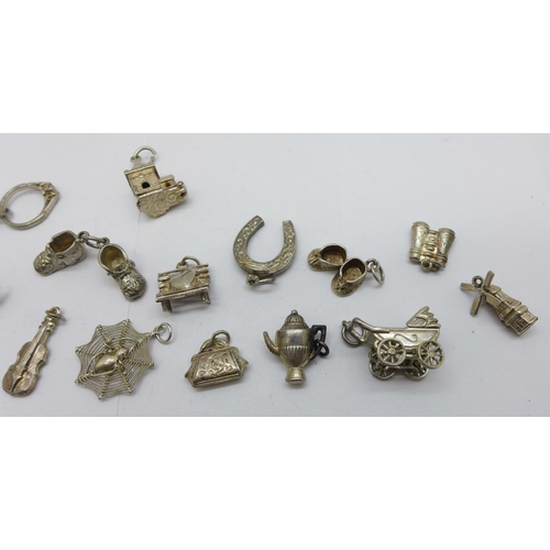 1216 - Twenty silver charms, 36g