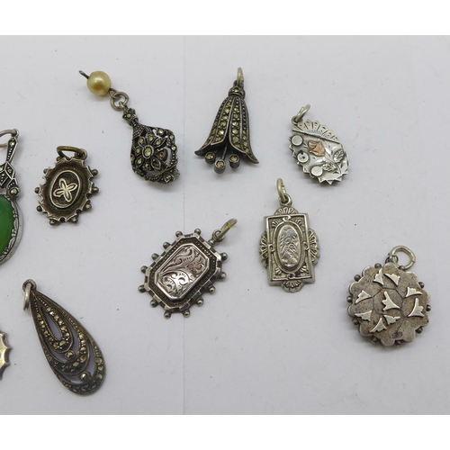 1217 - A collection of white metal pendants and charms including Victorian, four marked silver