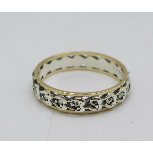 1220 - A 9ct gold, silver and marcasite eternity ring, L