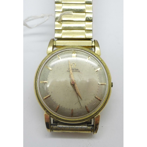 1253 - A gold plated Omega automatic wristwatch, the case back bears inscription dated 1960, glass loose an... 