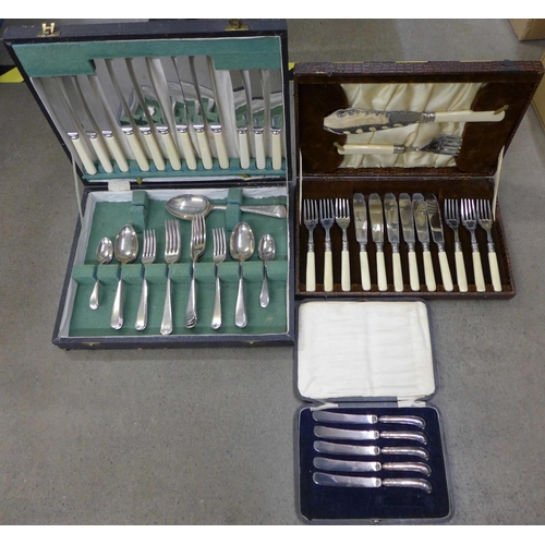 1271B - Five silver handled knives, cased and two sets of flatware