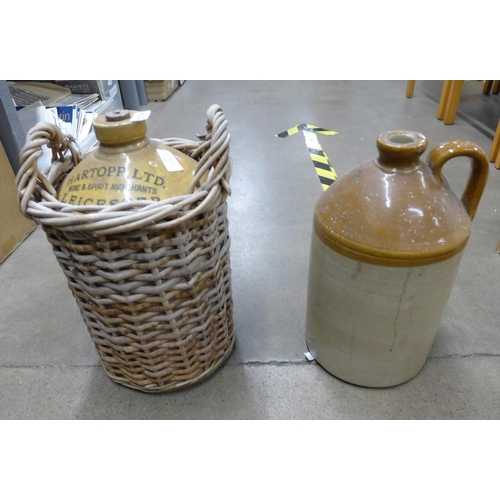 1275A - Two stoneware bottles, one marked Hartopp Ltd., Leicester, in a wicker holder **PLEASE NOTE THIS LOT... 