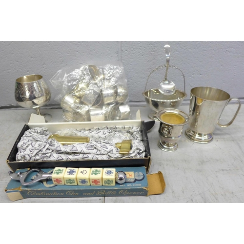 1280A - Four silver plated items:- a sauce bowl, mug, goblet and miniature vase, a solid brass corkscrew, a ... 