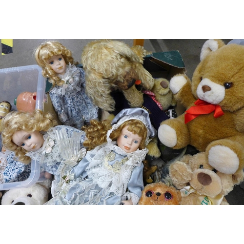 1300 - A box of soft toys and plastic dinosaur figures and two composition dolls in parts, a Woody doll (no... 