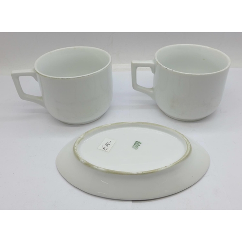 635 - Two cups decorated with German cross medal, acorns and ribbon, and a later oval dish