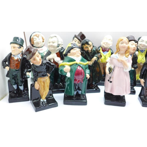 660 - A collection of twenty-four Royal Doulton Charles Dickens character figures