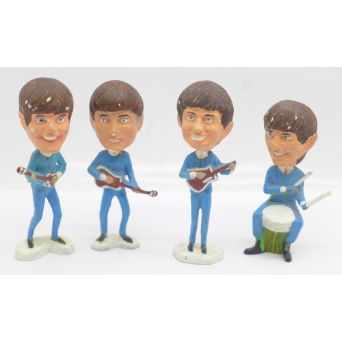 666 - A set of four plastic Beatles figures