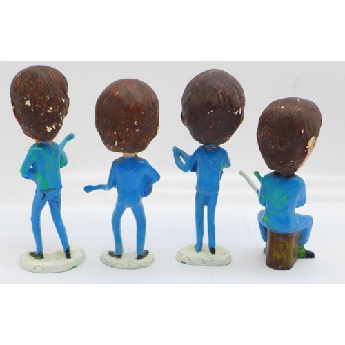 666 - A set of four plastic Beatles figures