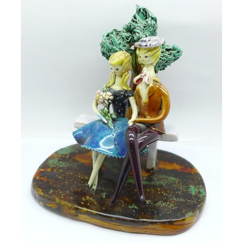 668 - A majolica Parisian figure group, 16.5cm