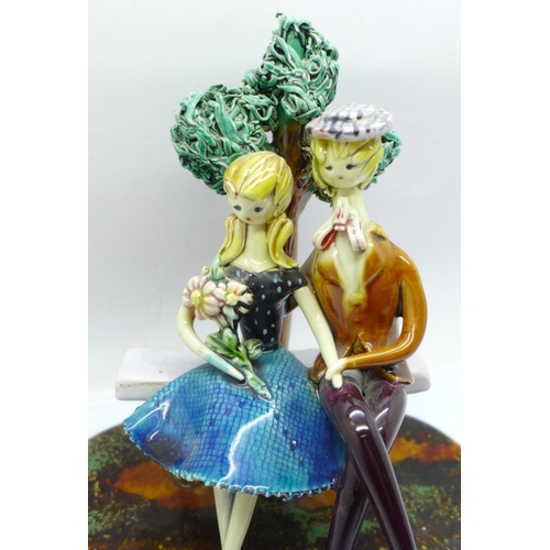 668 - A majolica Parisian figure group, 16.5cm