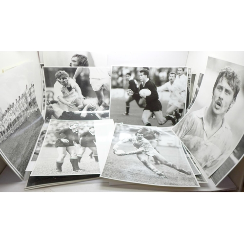 670 - A collection of thirty-three Rugby black and white press photographs