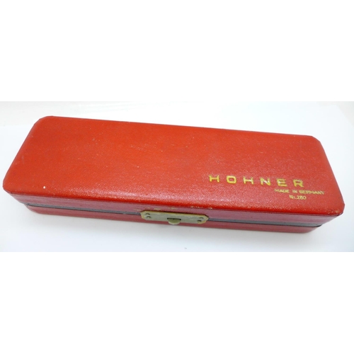 671 - A Hohner The 64 Chromonica Professional model harmonica, cased