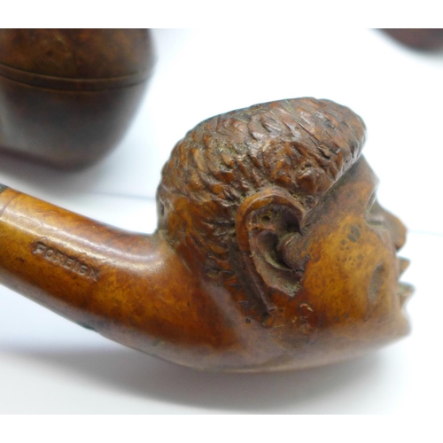 675 - Five pipes including one with carved head, a tobacco pouch and a tobacco box