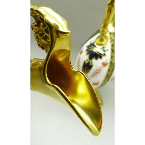 680 - A pair of Royal Crown Derby 1128 pattern ewers, 25.5cm, (one with hairline crack on the handle)