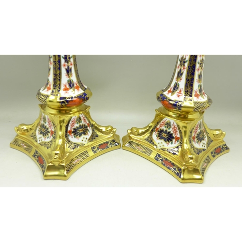 682 - A pair of Royal Crown Derby 1128 pattern candlesticks, 27cm