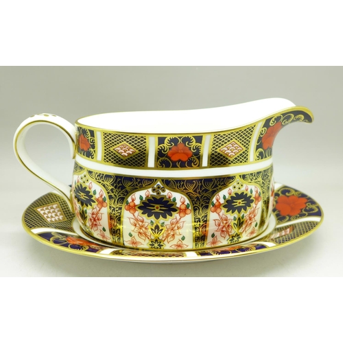 685 - A Royal Crown Derby 1128 pattern gravy boat with stand