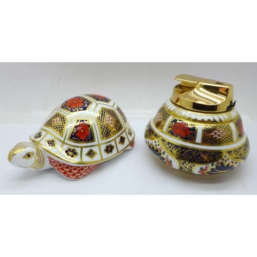 692 - A Royal Crown Derby 1128 pattern table lighter and a turtle paperweight, (2)