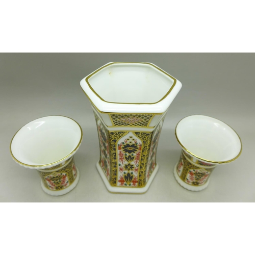 693 - A pair of small Royal Crown Derby 1128 pattern vases and one other vase, pair 63mm