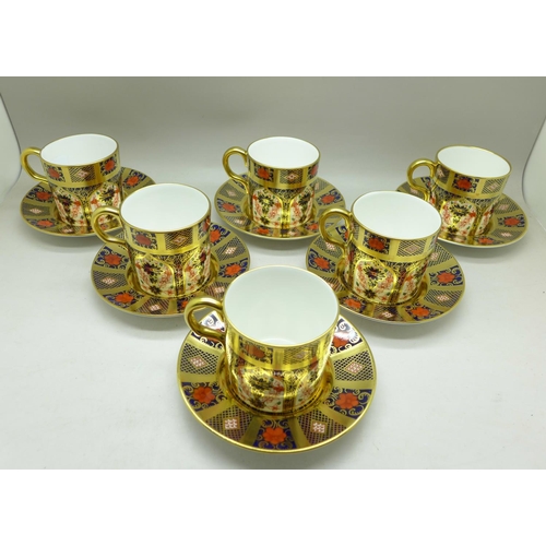 695 - A set of six Royal Crown Derby 1128 pattern coffee cans and saucers