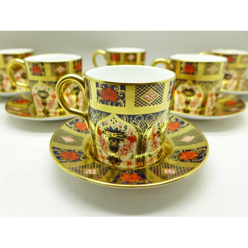 695 - A set of six Royal Crown Derby 1128 pattern coffee cans and saucers